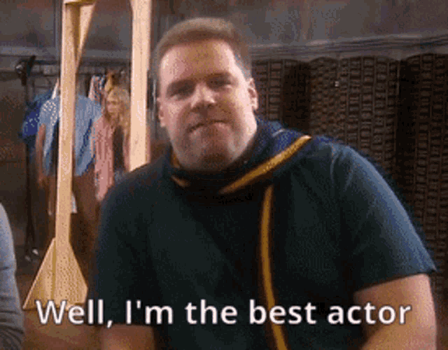 a man with a scarf around his neck says well i 'm the best actor ..