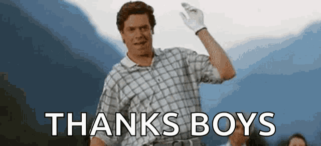a man in a plaid shirt is waving his hand and the words `` thanks boys '' are above him .
