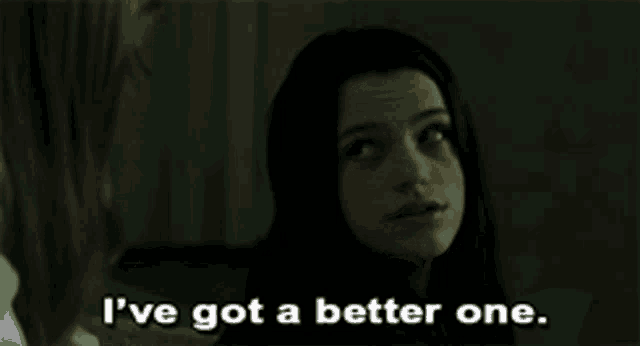 a woman says " i 've got a better one " in a dark room