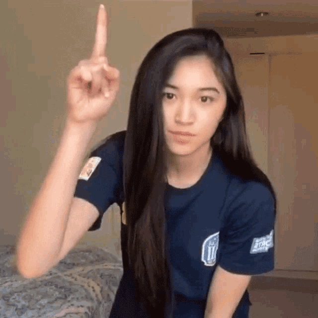 a woman wearing a blue shirt that says ucsd on it