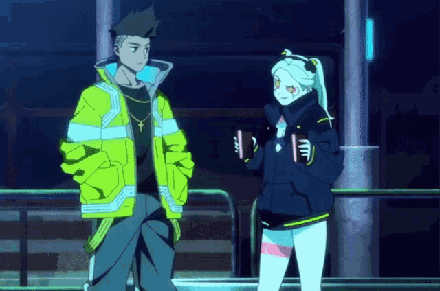 a man and a woman standing next to each other