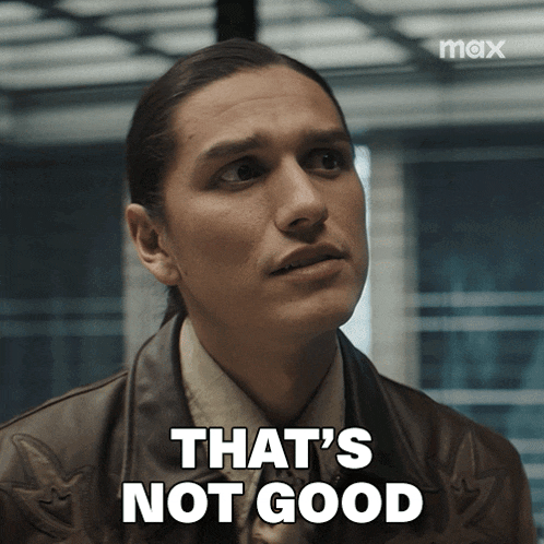 a man says that 's not good in front of a max sign