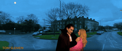 a picture of a vampire and a woman with the name tom slemen on the bottom