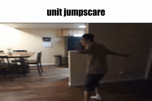 a picture of a man jumping in a room with the words unit jumpscare above him