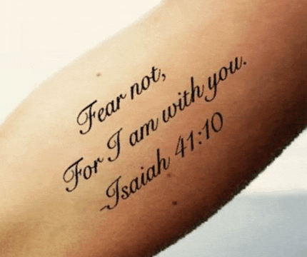 a tattoo that says fear not for i am with you on a person 's arm