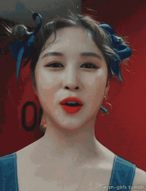 a close up of a woman 's face with the words wjsn-girls tumblr underneath her