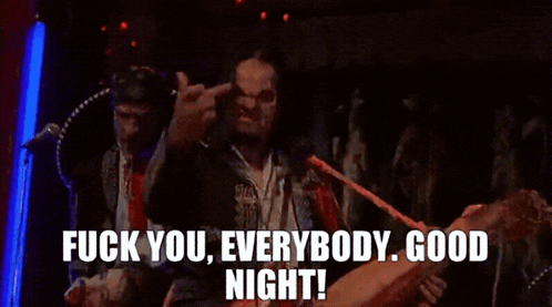 a man giving the middle finger with the words " fuck you everybody good night " behind him