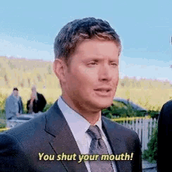 a man in a suit says you shut your mouth