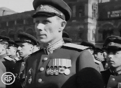 a black and white photo of a man in a military uniform with the letter f on the bottom
