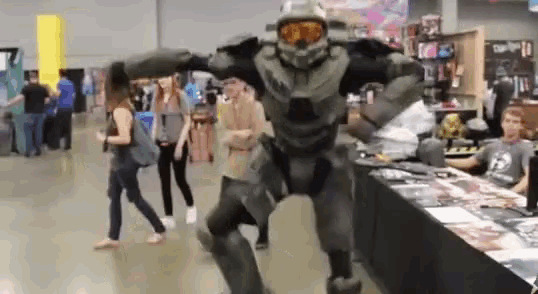 a man in a halo costume is dancing in a room