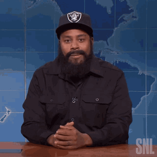 a man with a beard wearing a raiders hat says " good choice snl "