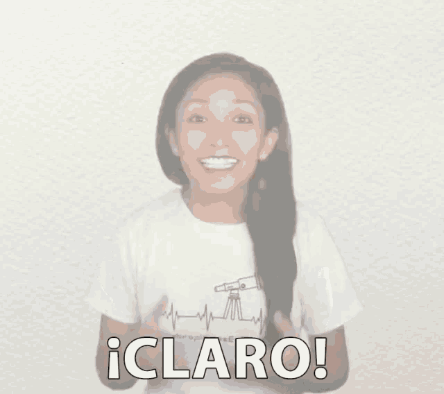 a woman wearing a white shirt that says claro