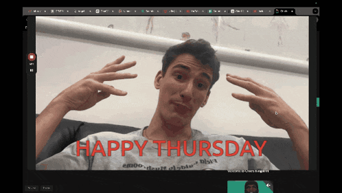 a man sitting on a couch with the words happy thursday in red