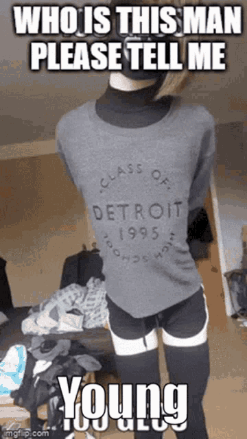 a person wearing a sweater that says class of detroit 1995 on it