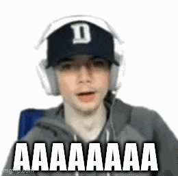 a man wearing headphones and a baseball cap with the letter d on it is screaming .
