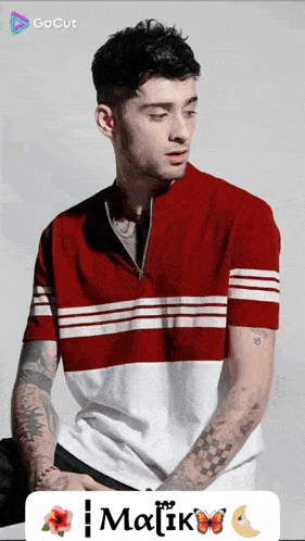 a man wearing a red and white striped shirt with the name malik on the bottom