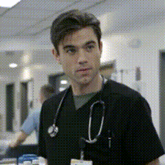 a man with a stethoscope around his neck is wearing a black scrub