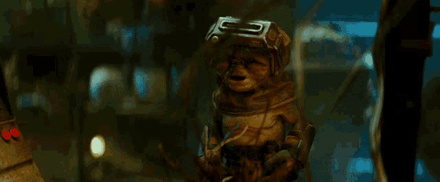 a strange creature with a helmet that has the letter g on it is standing in a dark room
