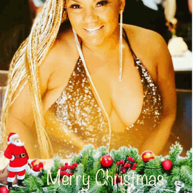 a woman in a sequined top stands in front of a merry christmas decoration