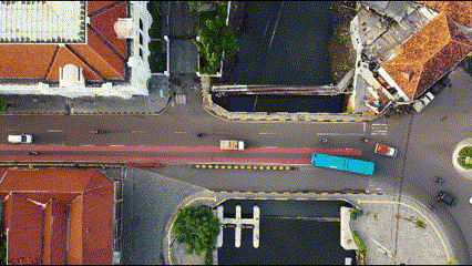 an aerial view of a city street with the letter h on the sidewalk