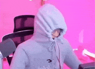 a person wearing a blue hoodie with a hood on their head .