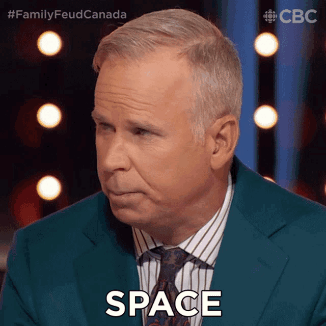 a man in a suit and tie says space in front of a cbs logo