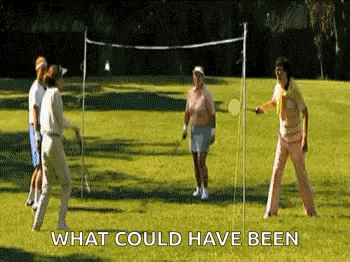a group of people are playing badminton on a lush green field with the caption what could have been .