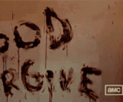 a wall with the words god forgive us written in blood