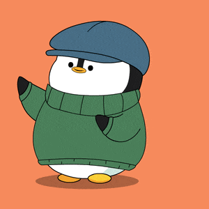 a penguin wearing a green sweater and hat