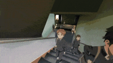 a group of people walking down stairs in a building