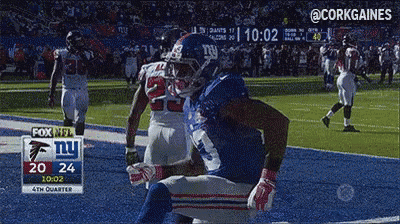 a football game is being played between the new york giants and atlanta falcons