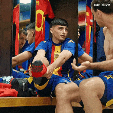 a man in a blue and yellow jersey with the number 10 on it