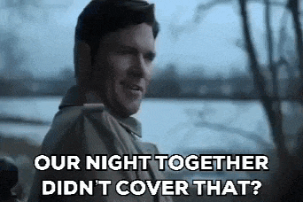 a man in a trench coat is talking to another man and says `` our night together did n't cover that '' .