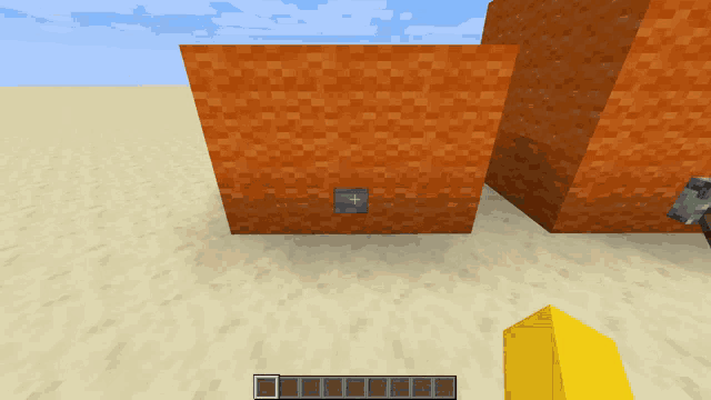 a screenshot of a video game with a hammer and a yellow block