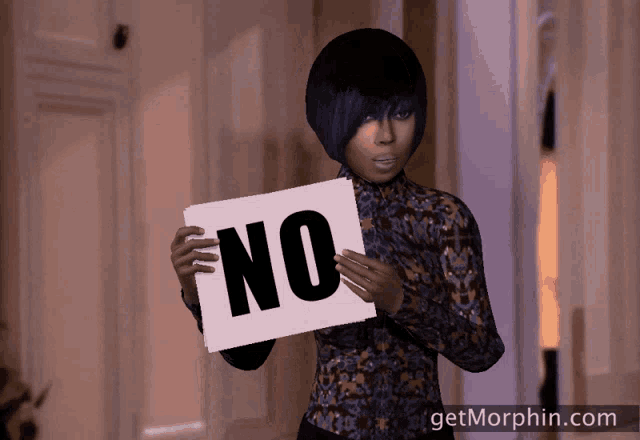 a woman holds a sign that says no in her hands