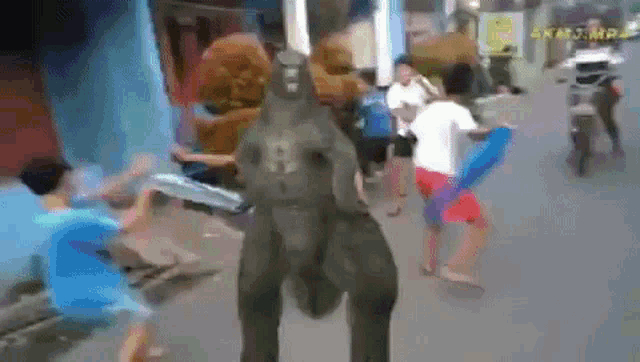 a group of people are standing around a statue of an elephant with the number 9 on it