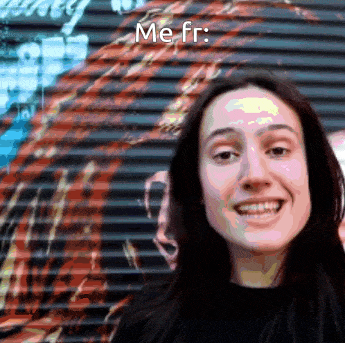 a woman is smiling in front of a wall that says " me fr "