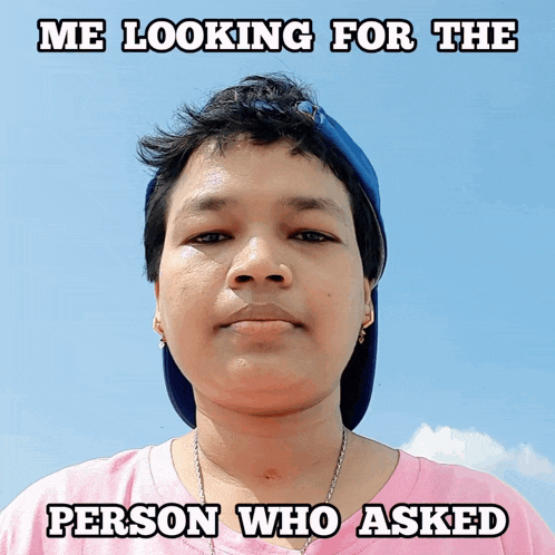 a woman wearing a pink shirt and a blue hat with the caption " me looking for the person who asked "
