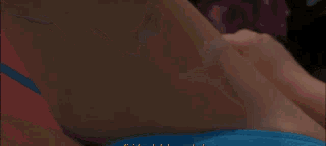 a woman in a blue bikini is laying down with the words no hay nada mas written on the bottom