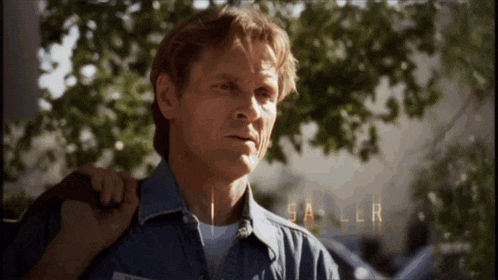 a man in a denim shirt has the name saller written on his chest