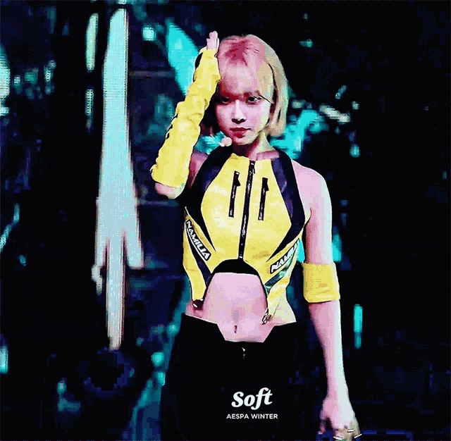 a woman in a yellow and black outfit with the word soft on the bottom right