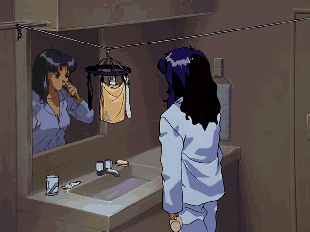 a woman is brushing her teeth in front of a bathroom sink