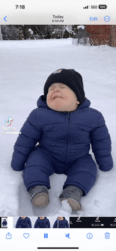 a baby is crying in the snow and the time is 6:18 am