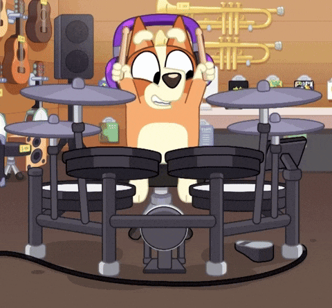 a cartoon dog is playing drums in a room with a trumpet on the wall