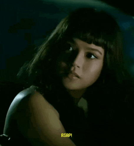 a close up of a woman 's face with the word asap in yellow letters