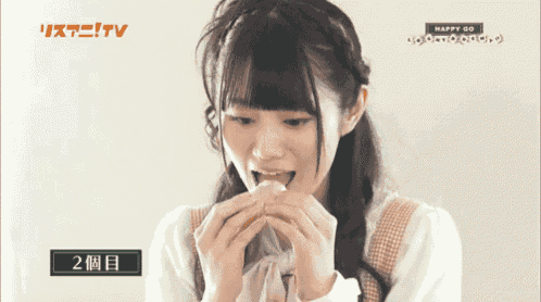 a girl is eating a sandwich with the words happy go on the bottom