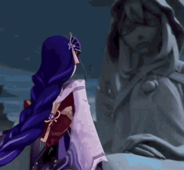 a woman in a purple kimono is standing next to a statue