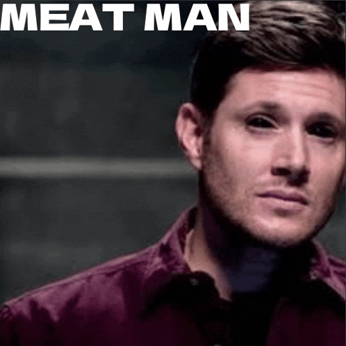 a close up of a man 's face with black eyes and the words meat man written above him .