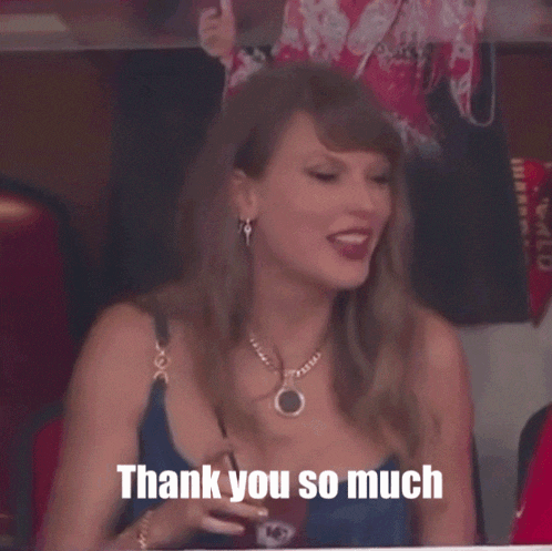 a woman says thank you so much while sitting in a stadium