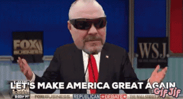 a man in a suit and tie with sunglasses says let 's make america great again